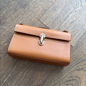 SAVETTE
Symmetry Pochette Leather Top-Handle Bag Brown